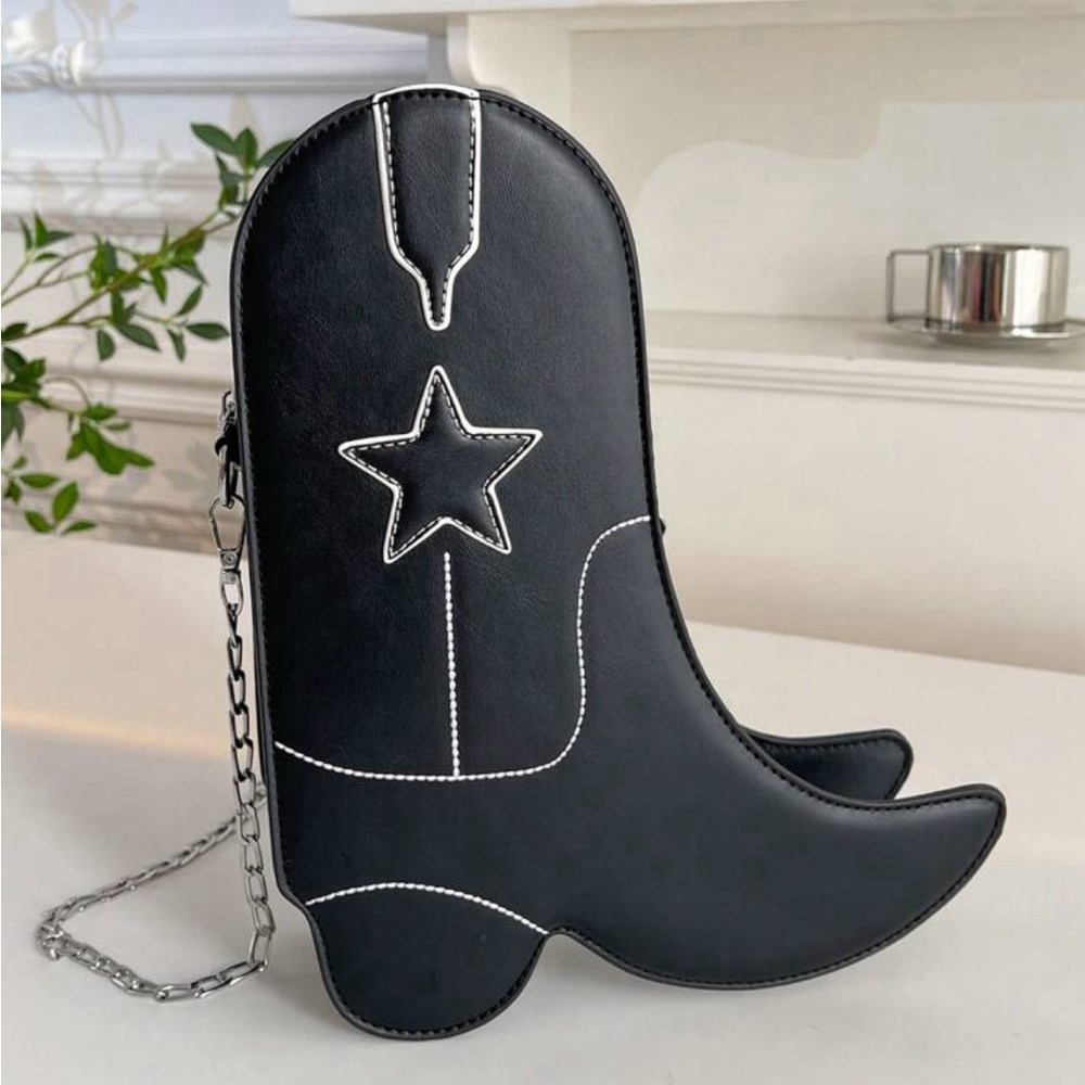 Black cowboy boots shaped purse.